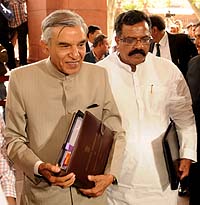 the union minister for railways,  pawan kumar bansal along with the minister of state for railways,  k.j. surya prakash reddy arriving at parliament house to present the rail budget 2013-14, in new delhi on february 26, 2013.